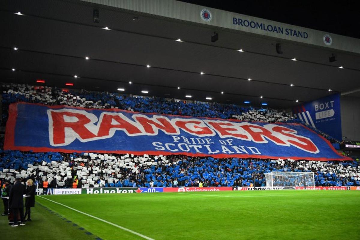 Rangers fans display a large banner in the crowd ahead of the UEFA Europa League group C football match between Rangers and Aris Limassol at the Ibrox Stadium in Glasgow on November 30, 2023. ANDY BUCHANAN / AFP