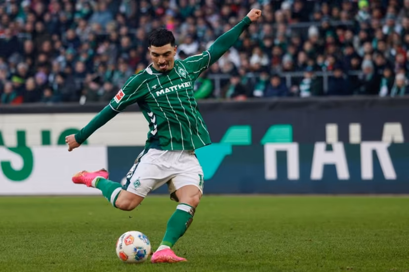 Bremen's Spanish midfielder #18 Cameron Puertas shoots during the German first division Bundesliga football match between SV Werder Bremen and FC Bayern Munich in Bremen, northern Germany February 14, 2026. Focke Strangmann / AFP