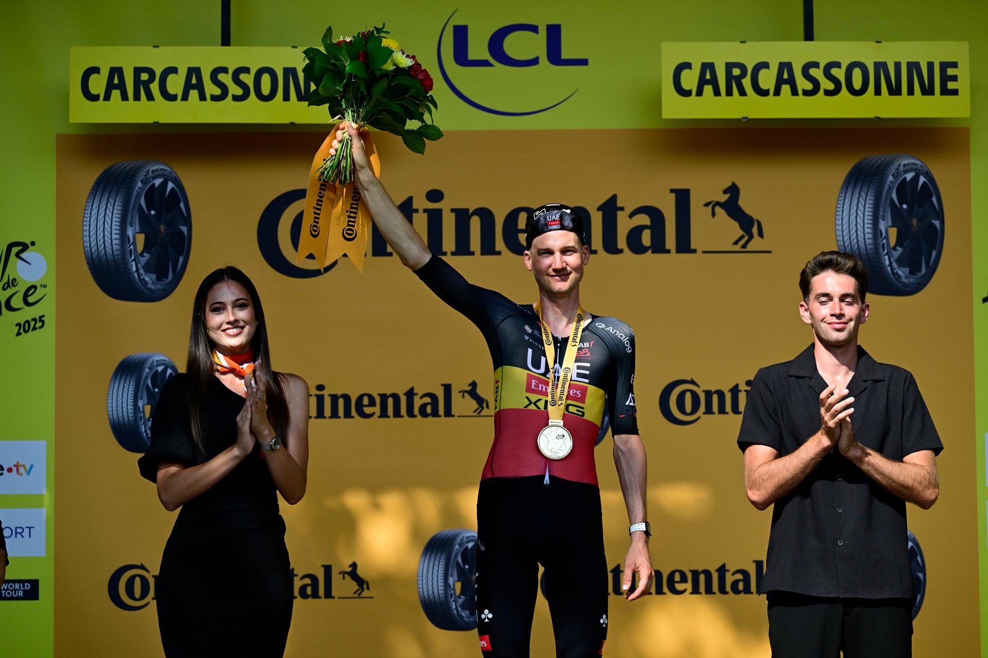 Belgian Tim Wellens of UAE Team Emirates and pictured on the podium after winning the stage 15 of the 2025 Tour de France cycling race, from Muret to Carcasonne (169 km), on Sunday 20 July 2025 in France. The 112th edition of the Tour de France starts on Saturday 5 July in Lille, France, and will finish in Paris, France on the 27th of July. BELGA PHOTO DIRK WAEM