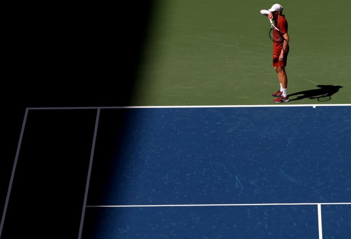 Italy's Jannik Sinner pauses as he plays Canada's Denis Shapovalov during their men's singles third round match on day seven of the US Open tennis tournament at the USTA Billie Jean King National Tennis Center in New York City on August 30, 2025. TIMOTHY A. CLARY / AFP
