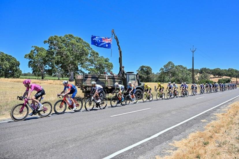The peloton rides through the Adelaide Hills during stage three of the Tour Down Under UCI Men's Cycling race in Adelaide on January 23, 2026. Brenton Edwards / AFP