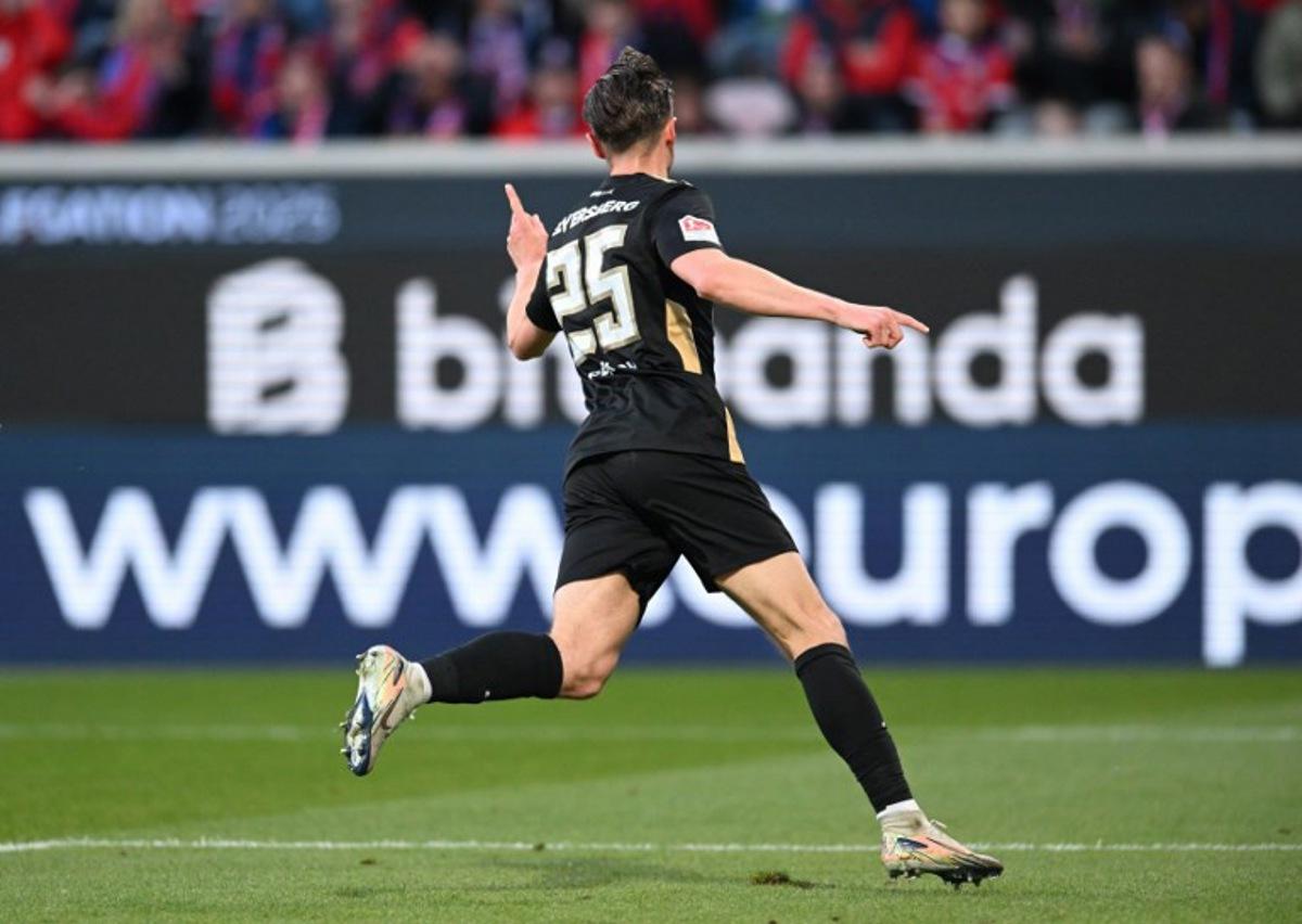Elversberg's German midfielder #25 Lukas Petkov celebrates scoring the opening goal during the German Bundesliga relegation first-leg football match between FC Heidenheim and SV Elversberg in Heidenheim on May 22, 2025. THOMAS KIENZLE / AFP