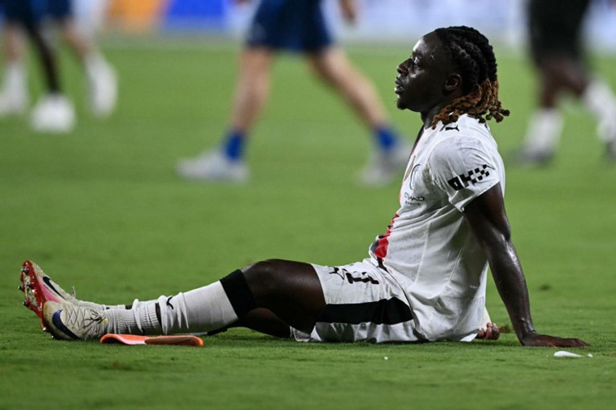 Manchester City's Belgian midfielder #11 Jeremy Doku reacts after losing the FIFA Club World Cup 2025 round of 16 football match between England's Manchester City and Saudi's Al-Hilal at the Camping World stadium in Orlando on June 30, 2025. PATRICIA DE MELO MOREIRA / AFP