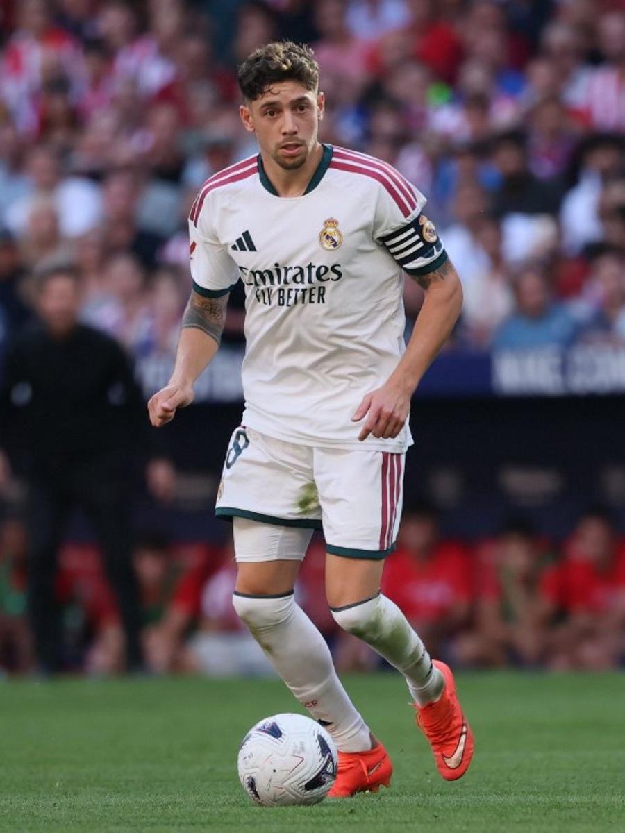 Real Madrid's Uruguayan midfielder #08 Federico Valverde runs with the ball during the Spanish league football match between Club Atletico de Madrid and Real Madrid CF at the Metropolitano stadium in Madrid on September 20, 2026. Thomas COEX / AFP