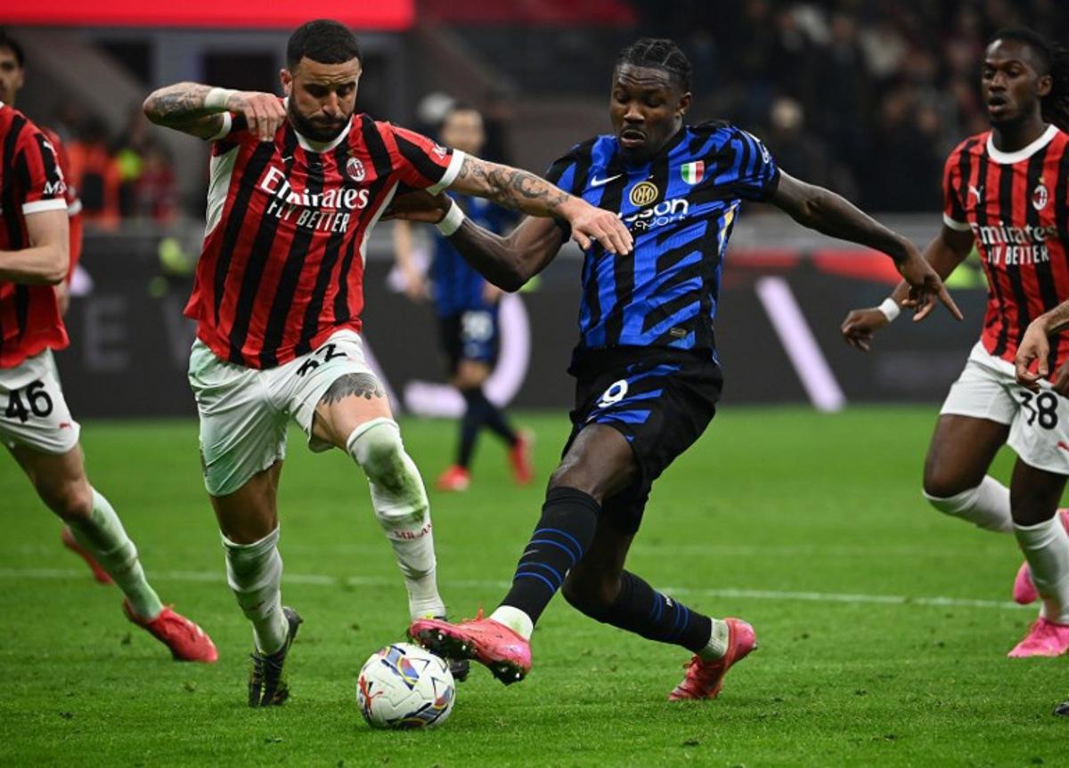 Inter Milan's French forward #09 Marcus Thuram (R) fights for the ball with AC Milan's British defender #32 Kyle Andrew Zac Walker during the Italian Cup semi-final first leg football match between AC Milan and Inter Milan at San Siro stadium in Milan, on April 2, 2025. Isabella BONOTTO / AFP