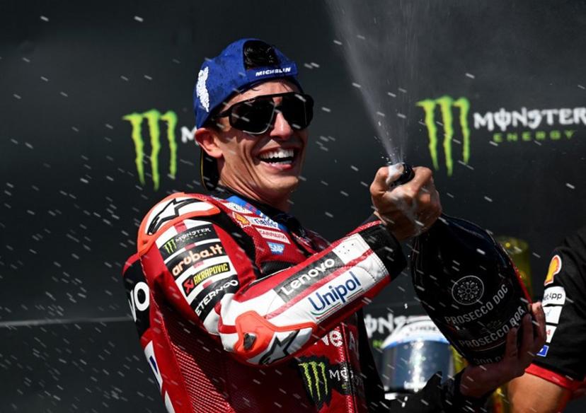 Team Ducati Lenovo Team's Marc Marquez celebrates on the podium with sparkling wine after winning the MotoGP Grand Prix of Czechia in Brno, Czech Republic, on June 21, 2026. Michal Cizek / AFP