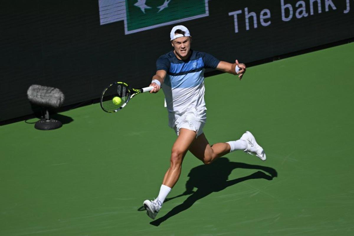 Denmark's Holger Rune returns the ball to Britain's Jack Draper during the men's singles final tennis match at the BNP Paribas Open at the Indian Wells Tennis Garden in Indian Wells, California, on March 16, 2025. Patrick T. Fallon / AFP