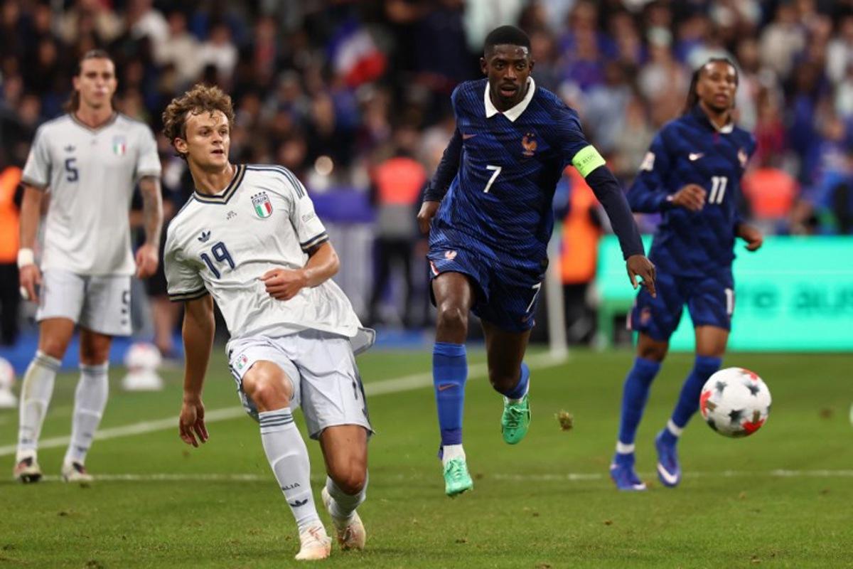 France's forward #07 Ousmane Dembele (R) and Italy's defender #19 Giorgio Scalvini (L) watch the ball during the UEFA Nations League, league A day 3: Group 1, football match between France and Italy at the Stade de France stadium in Saint-Denis, near Paris, on October 2, 2026. FRANCK FIFE / AFP