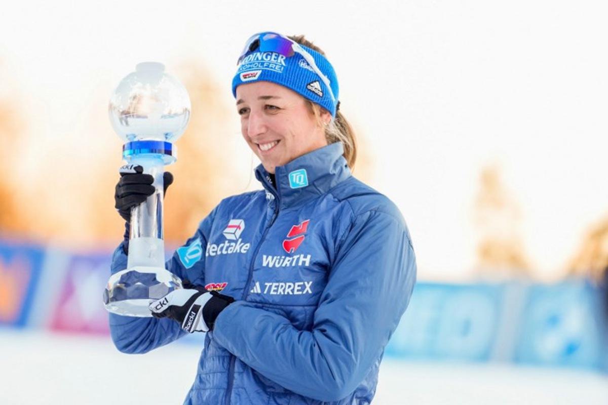 Winner Germany's Franziska Preuss celebrates with the trophy after the women's 7,5km Biathlon sprint in the World Cup in Holmenkollen on March 21, 2025. Javad Parsa / NTB / AFP