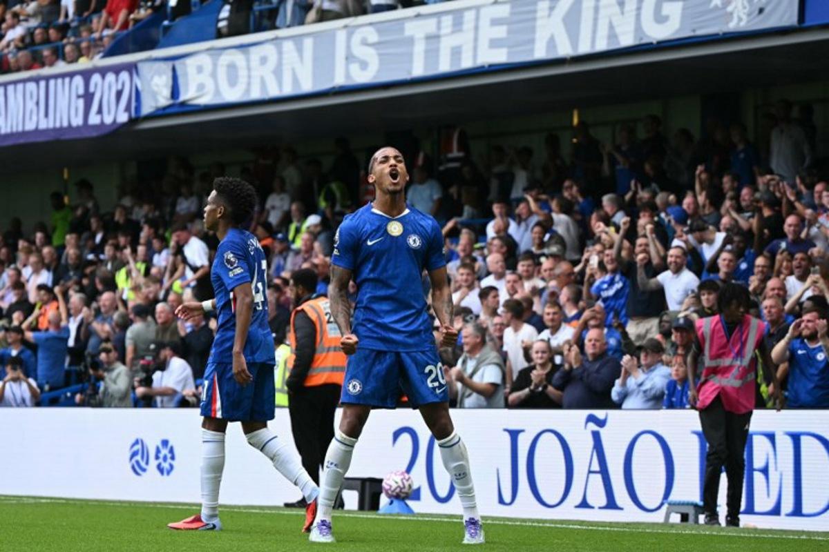 Chelsea's Brazilian striker #20 Joao Pedro celebrates after scoring the opening goal during the English Premier League football match between Chelsea and Fulham at Stamford Bridge in London on August 30, 2025. JUSTIN TALLIS / AFP
