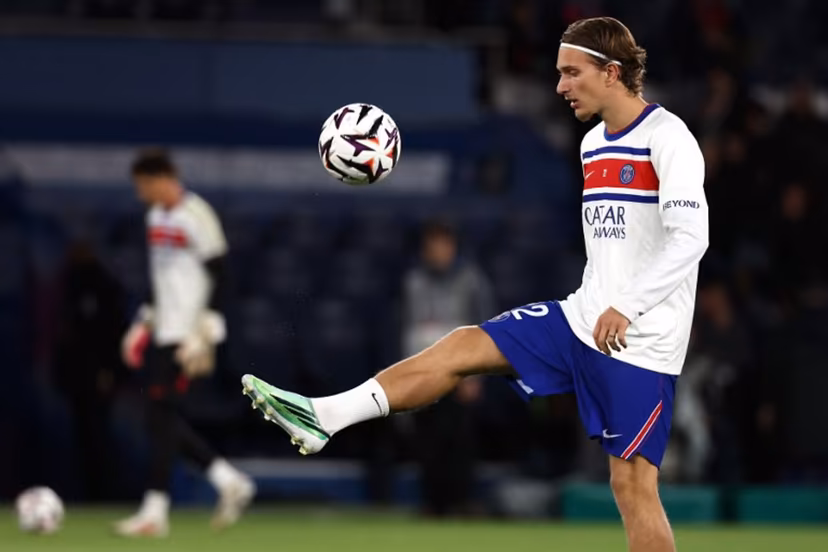 PSG's Belgian forward #22 Mika Godts controls the ball during the warm up ahead of the French L1 football match between Paris Saint-Germain (PSG) and Le Mans FC at the Parc des Princes stadium in Paris on October 10, 2026. FRANCK FIFE / AFP