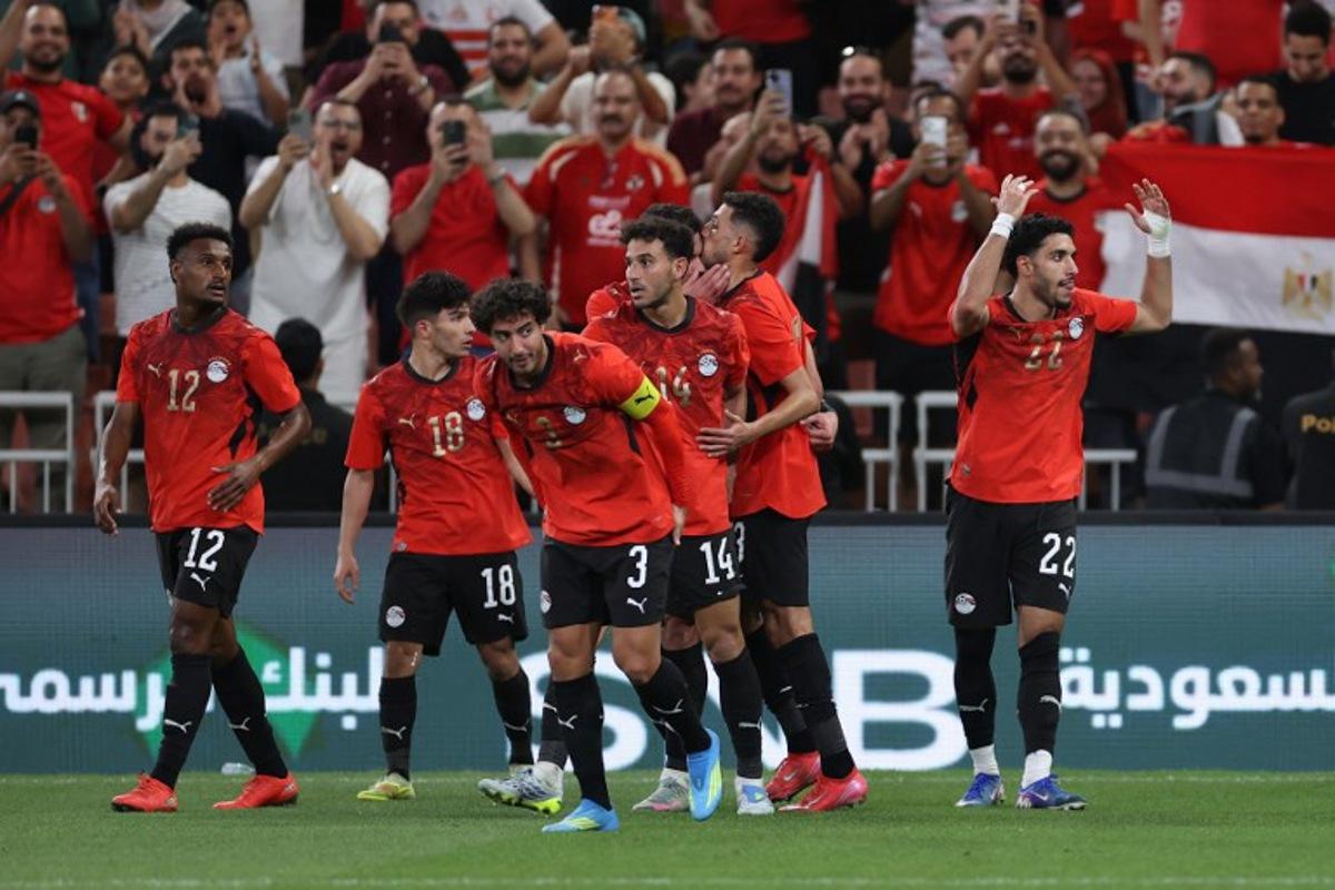 Egypt's forward #22 Omar Marmoush celebrates his goal with teammates during the friendly football match between Saudi Arabia and Egypt at King Abdullah Sports City in Jeddah on March 27, 2026. AFP