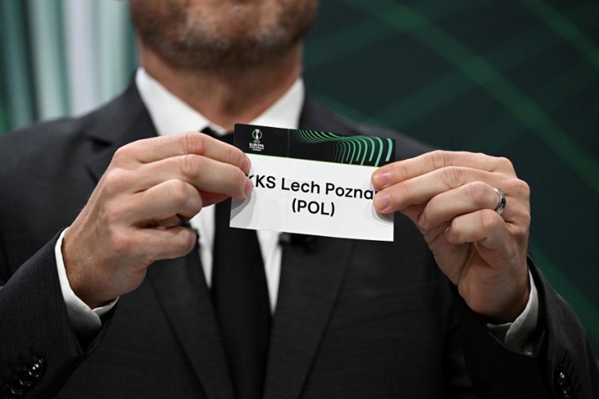 UEFA Europa Conference League final ambassador Czech former footballer Vladimir Smicer shows the paper slip of KKS Lech Poznan (POL) during the draw for the quarter-final, semi-final and final of the 2022-2023 UEFA Europa Conference League football tournament, in Nyon, on March 17, 2023. Fabrice COFFRINI / AFP