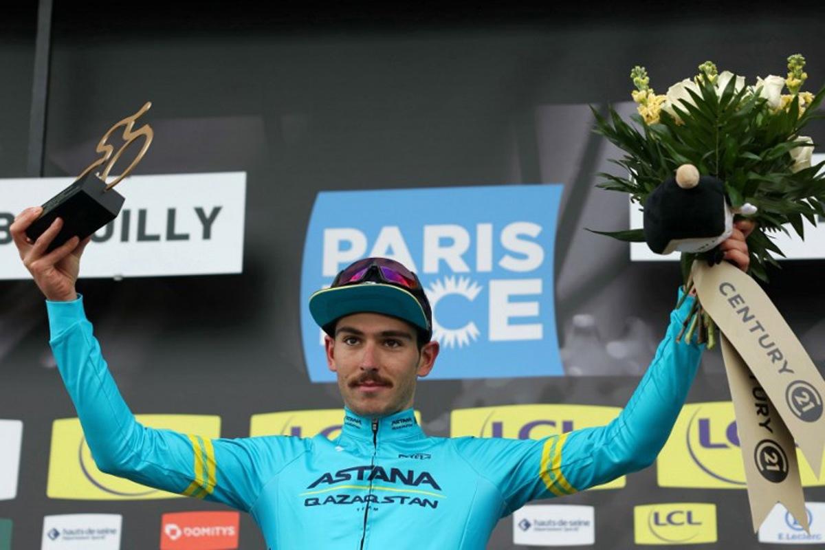 Astana Qazaqstan Team's Italian cyclist Christian Scaroni celebrates his combativity award on the podium after the 4th stage of the Paris-Nice cycling race, 183 km between Chalon-sur-Saone and Mont Brouilly, on March 6, 2024. Thomas SAMSON / AFP