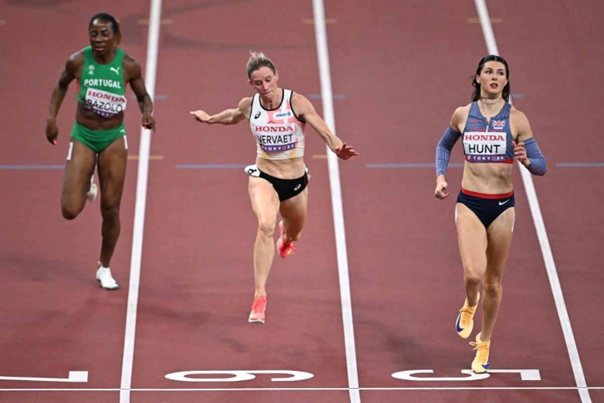 (From L) Portugal's Lorene Dorcas Bazolo, Belgium's Imke Vervaet and Great Britain's Amy Hunt run to the finish line in the women's 200m heats during the World Athletics Championships in Tokyo on September 17, 2025. Philip FONG / AFP