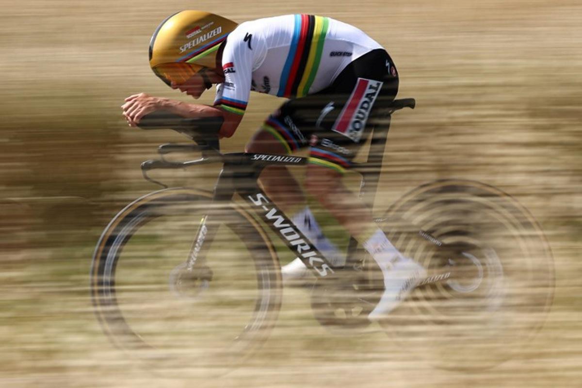 Soudal Quick-Step's Belgian rider Remco Evenepoel cycles during the 4th stage of the 77th edition of the Criterium du Dauphine cycling race, a 17,4 km individual time trial between Charmes-sur-Rhône and Saint-Péray, on June 11, 2025. Anne-Christine POUJOULAT / AFP