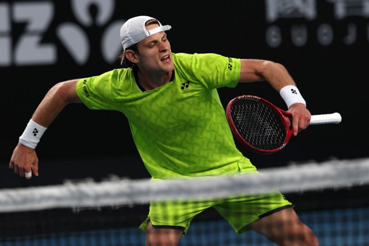 Belgium's Zizou Bergs reacts after a point against Poland's Hubert Hurkacz during their men's singles match on day three of the Australian Open tennis tournament in Melbourne on January 20, 2026. IZHAR KHAN / AFP
