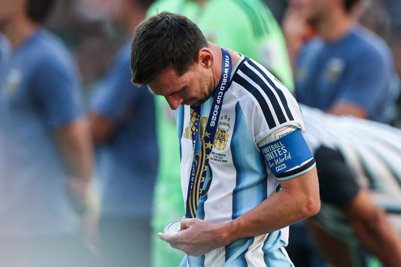 Argentina's forward #10 Lionel Messi looks at his second place medal after losing the 2026 World Cup football tournament final match between Spain and Argentina at the New York/New Jersey Stadium in East Rutherford on July 19, 2026. PATRICIA DE MELO MOREIRA / AFP