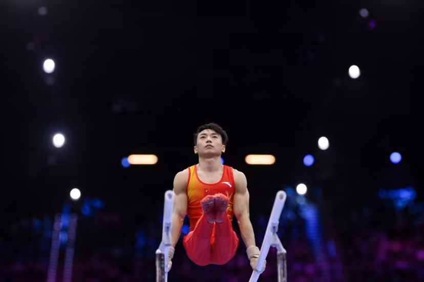 China's Jingyuan Zou competes in the Men's Parallel Bars Final during the 54th FIG Artistic Gymnastics World Championships, in Rotterdam, southern Netherlands, on October 25, 2026. JOHN THYS / AFP
