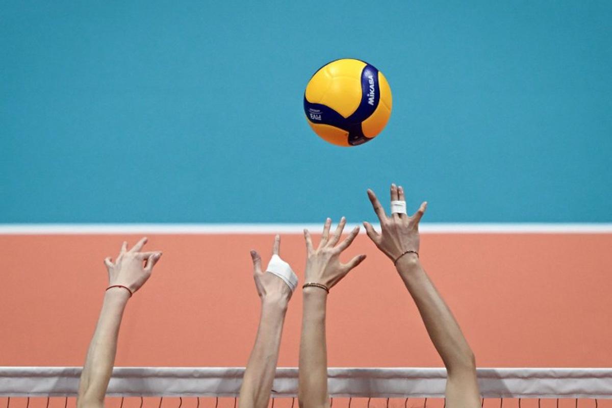 China's players attempt to block a ball in the women's gold medal volleyball event against Japan during the Hangzhou 2022 Asian Games in Hangzhou, in China's eastern Zhejiang province on Octorber 7, 2023. WANG Zhao / AFP