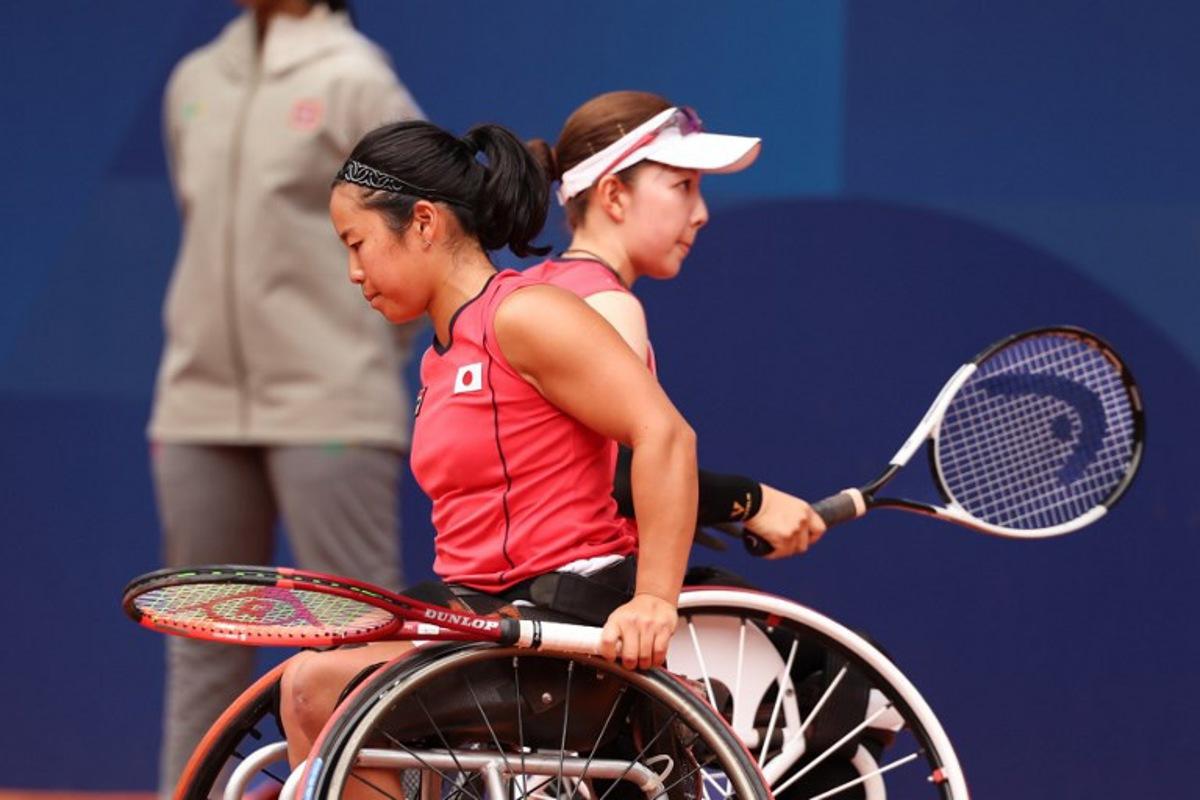 Japan's Manami Tanaka (R) and Yui Kamiji (L) compete during the women's wheelchair doubles tennis semi-final match against China's Ziying Wang and China's Luoyao Guo on the Court Philippe Chatrier at the Roland-Garros Stadium during the Paris 2024 Paralympic Games, on September 3, 2024. ALAIN JOCARD / AFP