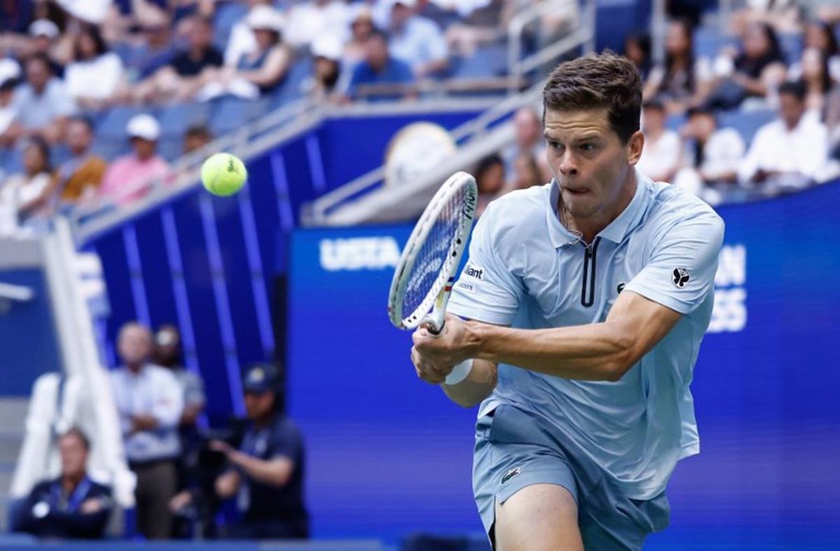Belgium's Alexander Blockx hits a return to Argentina's Francisco Cerundolo during their men's singles round of 16 tennis match on day nine of the US Open tennis tournament at the USTA Billie Jean King National Tennis Center in New York on September 7, 2026. kena betancur / AFP