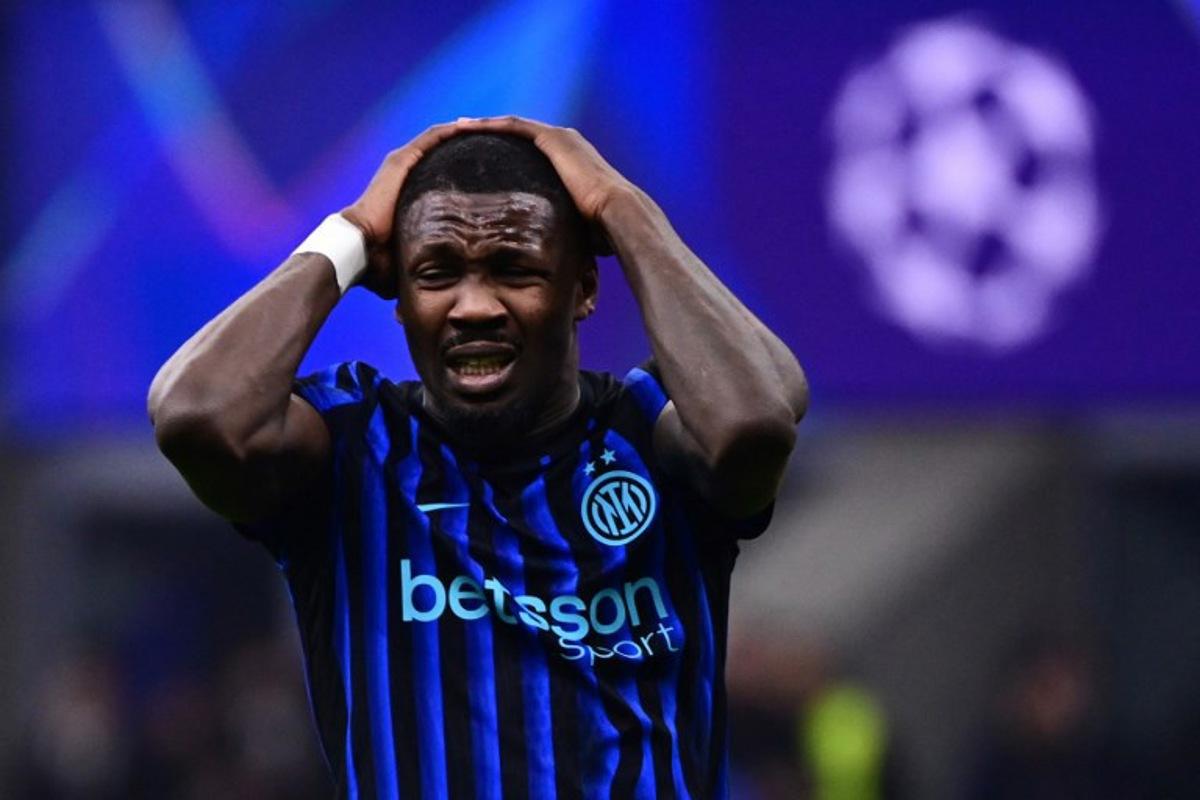 Inter Milan's French forward #09 Marcus Thuram reacts after a missing a goal opportunity during the UEFA Champions League second-leg play-off football match between Inter Milan and Bodo/Glimt at San Siro stadium in Milan, northern Italy, on February 24, 2026. PIERO CRUCIATTI / AFP