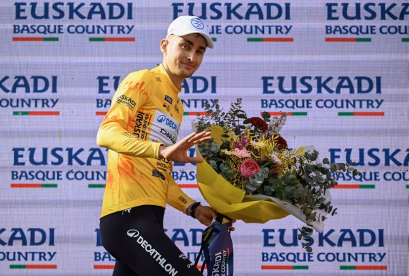 Team Decathlon CMA CGM's French rider Paul Seixas, the overall race leader and winner of the fifth stage of the Basque Country's Itzulia cycling tour, a 176.2 km race starting and finishing in Eibar, celebrates on the podium on April 10, 2026. ANDER GILLENEA / AFP