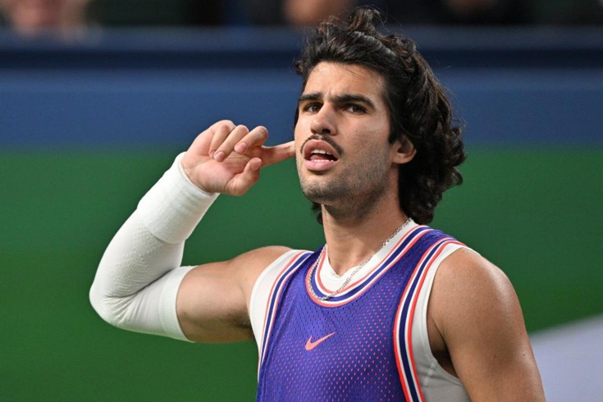 Spain's Carlos Alcaraz reacts during his men's singles match against Belgium's Zizou Bergs at the Shanghai Masters tennis tournament in Shanghai on October 12, 2026. Hector RETAMAL / AFP