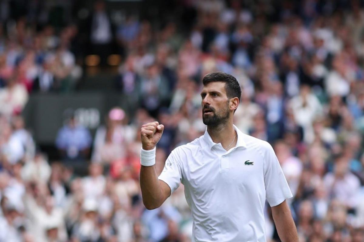 Serbia's Novak Djokovic reacts as he plays against Australia's Alex De Minaur during their men's singles fourth round tennis match on the eighth day of the 2025 Wimbledon Championships at The All England Lawn Tennis and Croquet Club in Wimbledon, southwest London, on July 7, 2025. Adrian Dennis / AFP