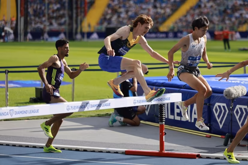 Japan's Ryuji Miura (R), Luxembourg's Ruben Querinjean (C) and Marocco's Mohamed Tindouft (L) compete in the 3000 m Steeple Chase competition of the Silesia Diamond League athletics meeting in Katowice, Poland, on August 23, 2026. Wojtek RADWANSKI / AFP