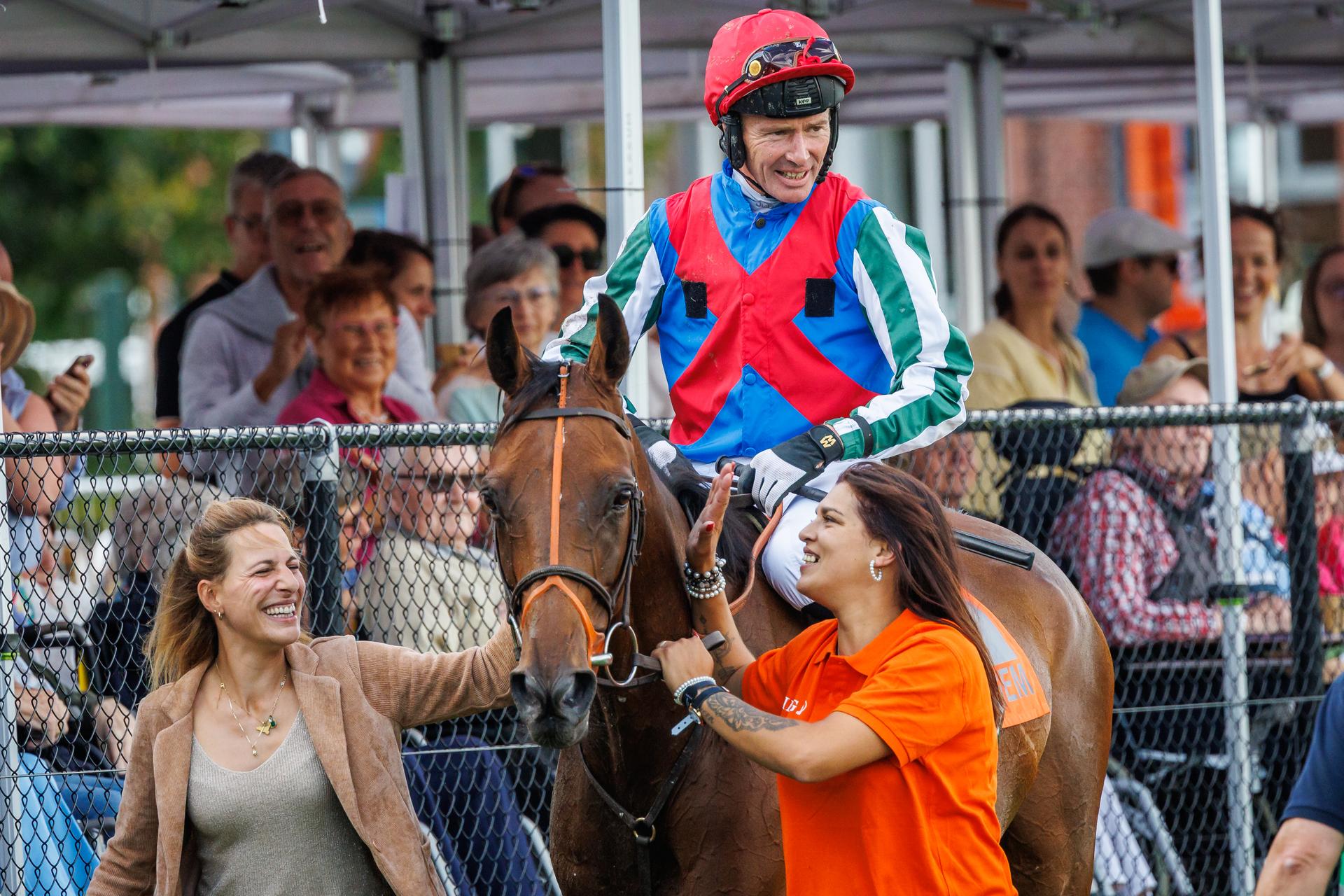 Jockey Johnny Charron and his horse Placenet celebrates after winning the Waregem Koerse, 'Grote Steeple Chase van Vlaanderen' (Great Steeple Chase of Flanders) horse race, at the Gaverbeek Hippodrome in Waregem, Tuesday 1 September 2026. BELGA PHOTO KURT DESPLENTER