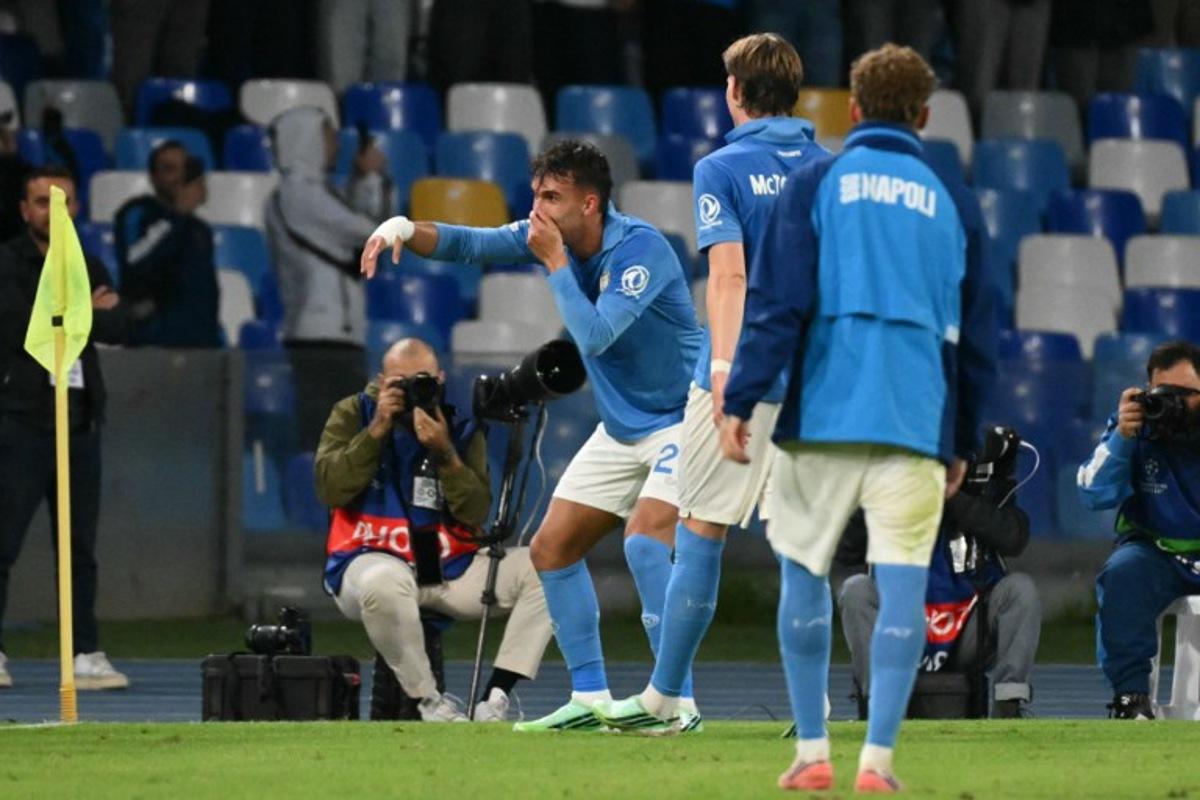 Napoli's Brazilian forward #23 Giovane celebrates Bodo/Glimt's Norwegian defender #04 Odin Bjørtuft own goal during the UEFA Champions League - first round day 3 football match between Napoli and Bodo Glimt at the Diego Armando Maradona stadium in Naples on October 20, 2026. Alberto PIZZOLI / AFP