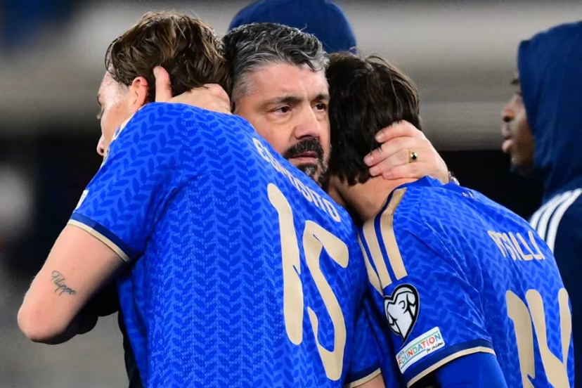 Italy's headcoach Gennaro Gattuso hugs Italy's forward #15 Francesco Pio Esposito and Italy's midfielder #14 Niccolo Pisilli after winning the play-off FIFA World Cup 2026 European qualification semi-final football match between Italy and North Ireland at the Gewiss stadium in Bergamo, on March 26, 2026. Stefano RELLANDINI / AFP