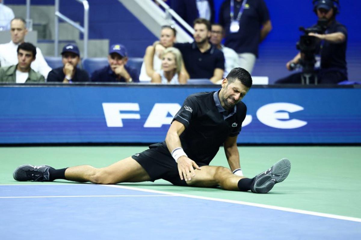 Serbia's Novak Djokovic reacts against Argentina's Mariano Navone during the men's singles first round tennis match on day one of the US Open tennis tournament at the USTA Billie Jean King National Tennis Center in New York City on August 30, 2026. CHARLY TRIBALLEAU / AFP