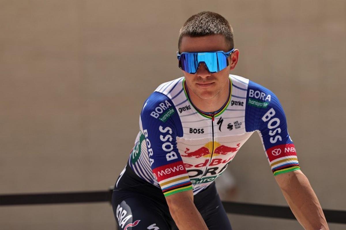 Red Bull-Bora-Hansgrohe's Belgian rider Remco Evenepoel looks on before the sixth stage of the UAE Tour cycling event from al-Ain Museum to Jebel Hafeet in Abu Dhabi on February 21, 2026. Fadel SENNA / AFP