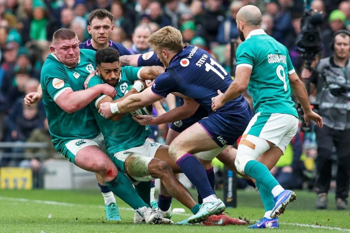 Ireland's wing Robert Baloucoune in action on the ball during the Six Nations international rugby union match between Ireland and Scotland at the Aviva Stadium in Dublin, on March 14, 2026. Paul Faith / AFP