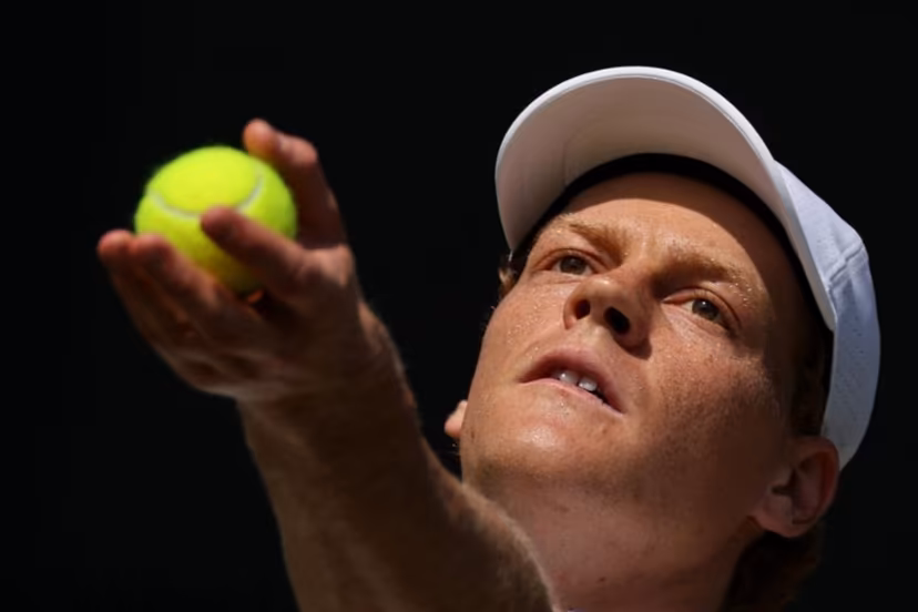 Italy's Jannik Sinner serves to US player Jenson Brooksby during their men's singles third round tennis match on the fifth day of the 2026 Wimbledon Championships at The All England Lawn Tennis and Croquet Club in Wimbledon, southwest London, on July 3, 2026. Adrian DENNIS / AFP