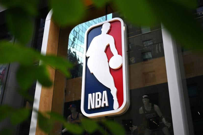 The NBA logo is seen outside an NBA fan store in New York on July 8, 2024. ANGELA WEISS / AFP