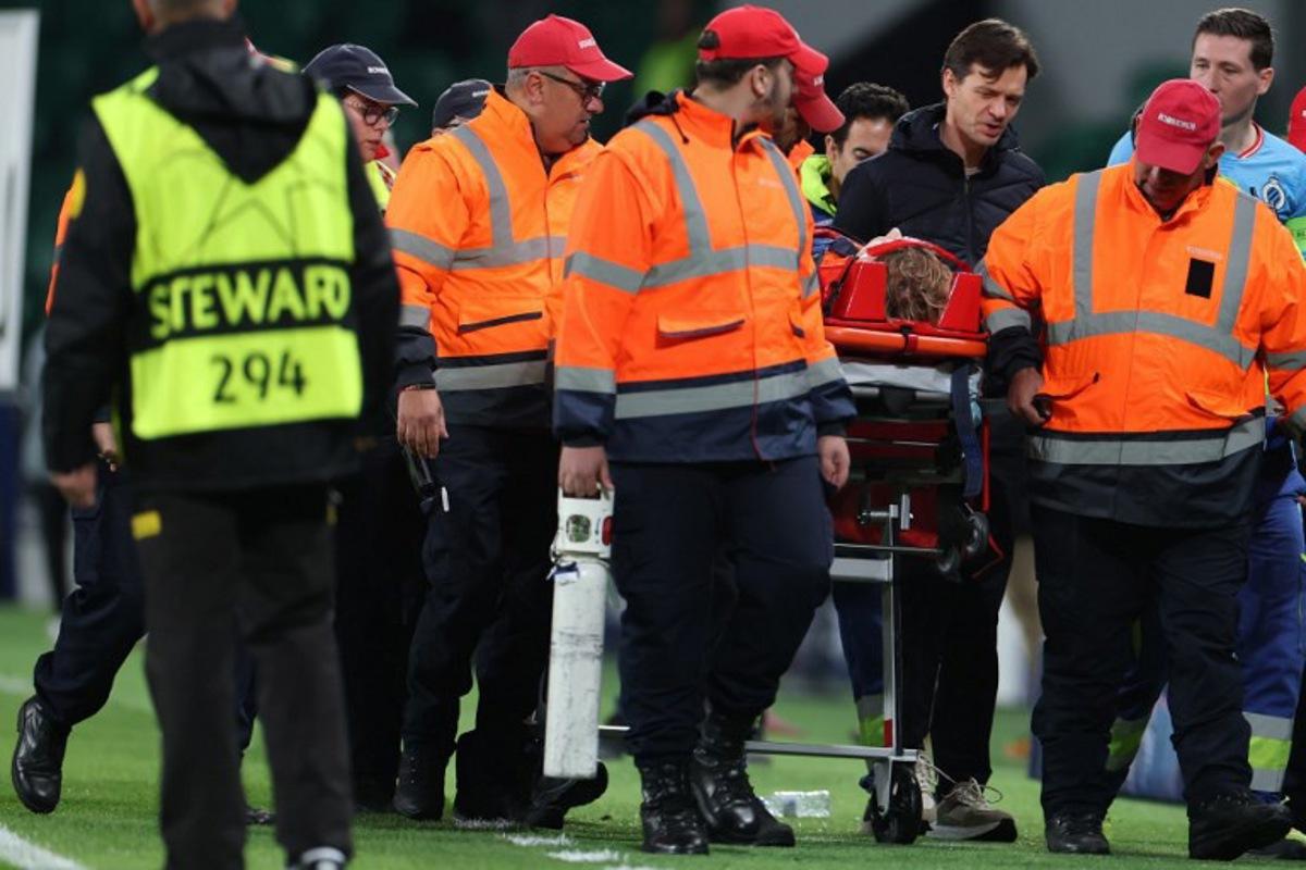 Club Brugge's Belgian goalkeeper #29 Nordin Jackers is carried on a stretcher after resulting injured during the UEFA Champions League, league phase day 5 football match between Sporting CP and Club Brugge at Jose Alvalade stadium in Lisbon on November 26, 2025. PATRICIA DE MELO MOREIRA / AFP