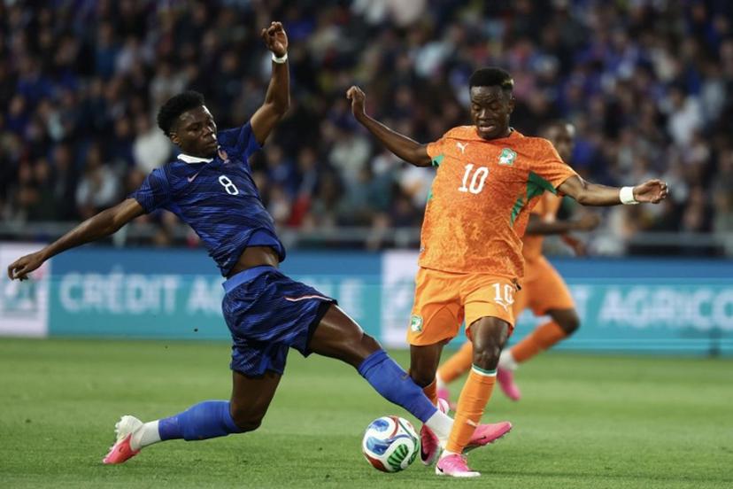 France's midfielder #08 Aurelien Tchouameni (L) fights for the ball with Ivory Coast's forward #10 Simon Adingra (R) during the international friendly football match between France and Ivory Coast ahead of the 2026 FIFA World Cup football tournament at the Stade de la Beaujoire in Nantes, western France, on June 4, 2026. FRANCK FIFE / AFP