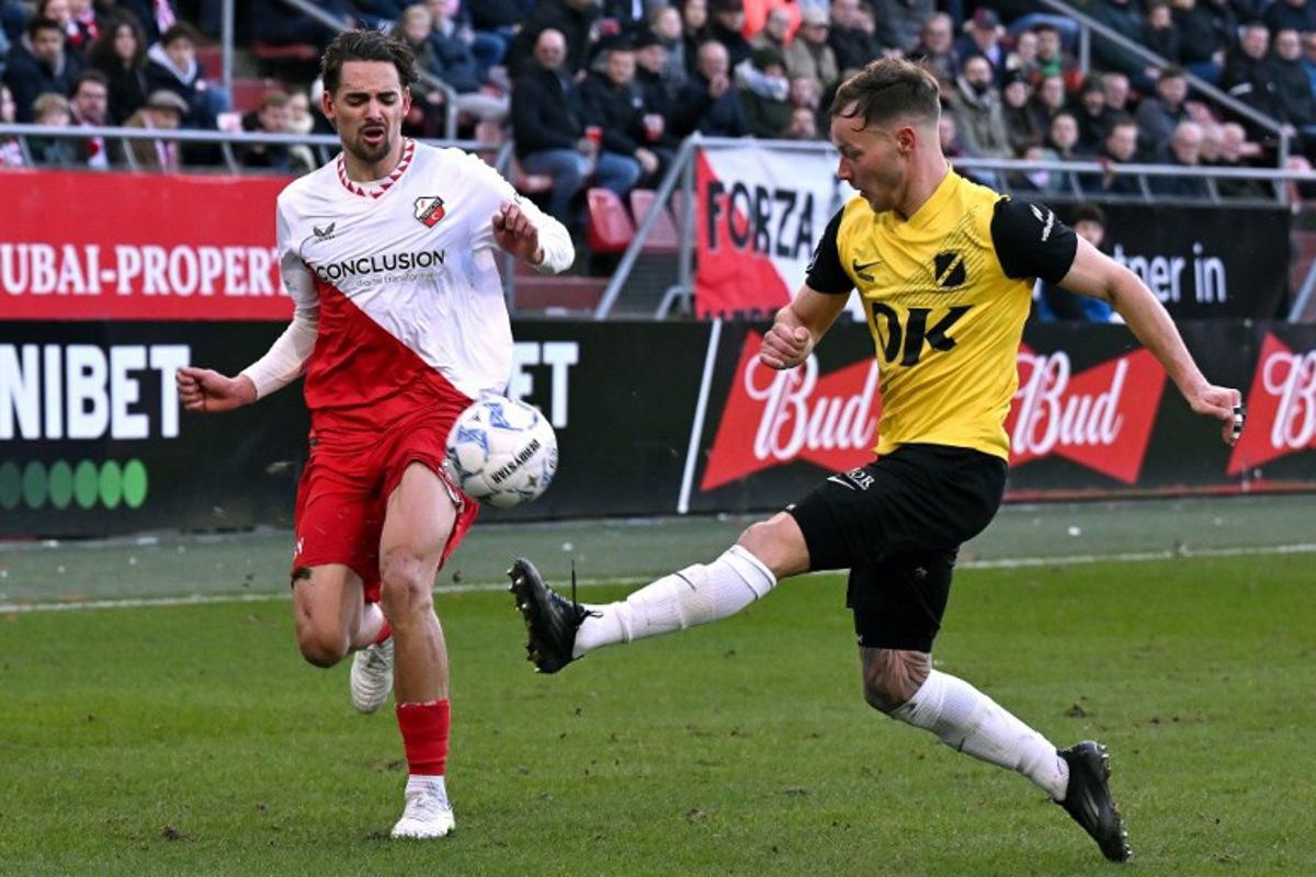 Utrecht's Belgian defender #02 Siebe Horemans (L) and Breda's Dutch defender #02 Boyd Lucassen fight for the ball during the Dutch Eredivisie first division football match between FC Utrecht and NAC Breda at the Galgenwaard stadium in Utrecht in Utrecht on March 1, 2025. Gerrit van Keulen / ANP / AFP