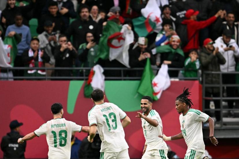 Algeria's forward #7 Riyad Mahrez (2R) celebrates scoring the team's second goal during the Africa Cup of Nations (CAN) Group E football match between Algeria and Sudan at Moulay Hassan Stadium in Rabat on December 24, 2025. SEBASTIEN BOZON / AFP