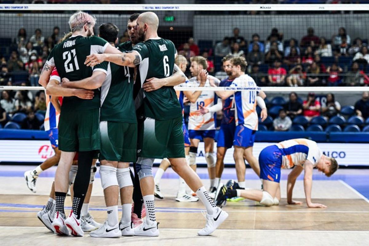 Team Poland celebrates after scoring a point against Netherlands during the 2025 Men's Volleyball World Championship at the Araneta Coliseum in Quezon City on September 17, 2025. SHERWIN VARDELEON / AFP