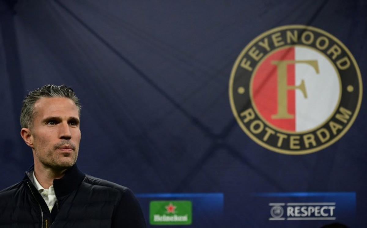 Feyenoord's Dutch head coach Robin van Persie looks on next to team logo before the UEFA Champions League round of 16 second-leg football match between Inter Milan and Feyenoord Rotterdam at the San Siro Stadium in Milan, on March 11, 2025. Piero CRUCIATTI / AFP