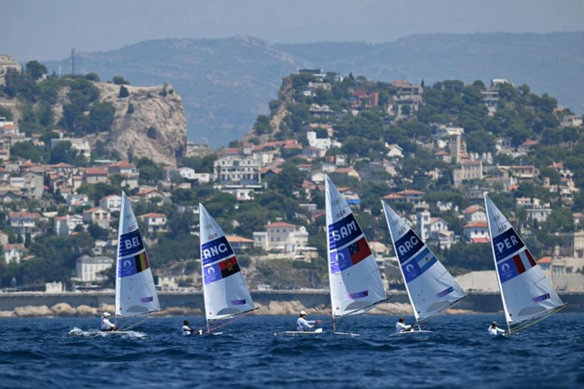 (LtoR) Belgium's William De Smet, Angola's Filipe Andre, Samoa's Eroni Leilua, Argentina's Francisco Guaragna Rigonat and Peru's Stefano Peschiera compete in race 7 of the men's ILCA 7 single-handed dinghy event during the Paris 2024 Olympic Games sailing competition at the Roucas-Blanc Marina in Marseille on August 4, 2024. NICOLAS TUCAT / AFP