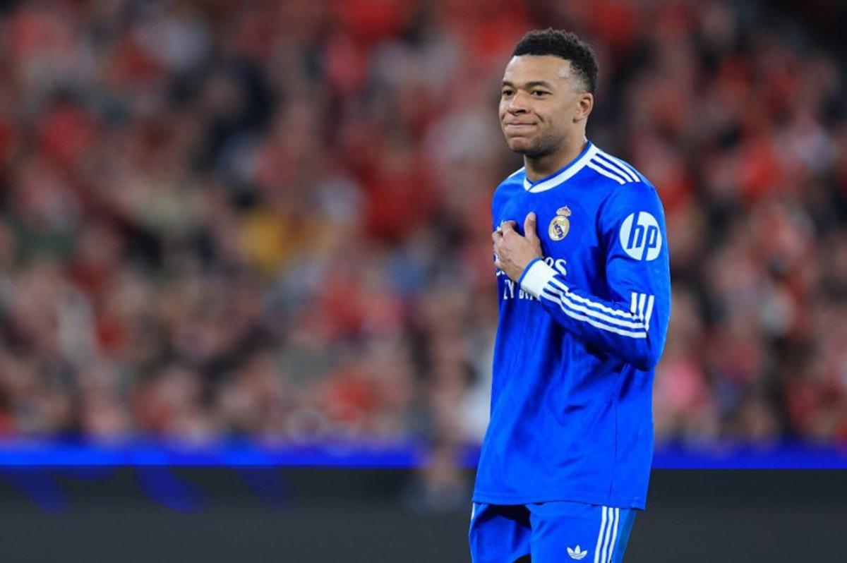 (FILES) Real Madrid's French forward #10 Kylian Mbappe reacts after missing a goal opportunity during the UEFA Champions League knockout round play-off first leg football match between SL Benfica and Real Madrid CF at Estadio da Luz in Lisbon on February 17, 2026. Kylian Mbappe, who has been suffering from a left knee injury since December 2025, is currently in Paris with Real Madrid's medical staff to "assess the progress" of his injury, but no "surgery" is planned "at this stage", AFP learned on March 2, 2026, from the French striker's entourage. PATRICIA DE MELO MOREIRA / AFP