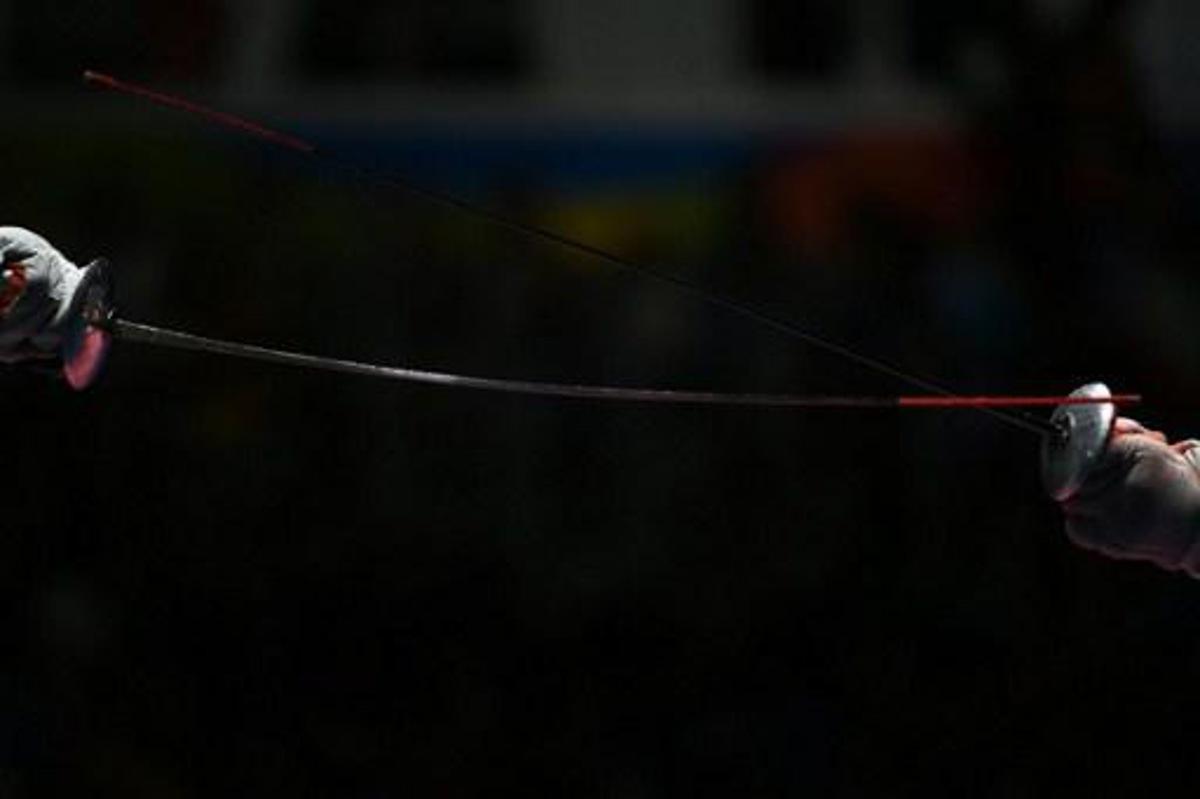 Russia's Timur Safin competes against China's Chen Haiwei during their men¿s individual foil quarter-final bout as part of the fencing event of the Rio 2016 Olympic Games, on August 7, 2016, at the Carioca Arena 3, in Rio de Janeiro.
Kirill KUDRYAVTSEV / AFP
