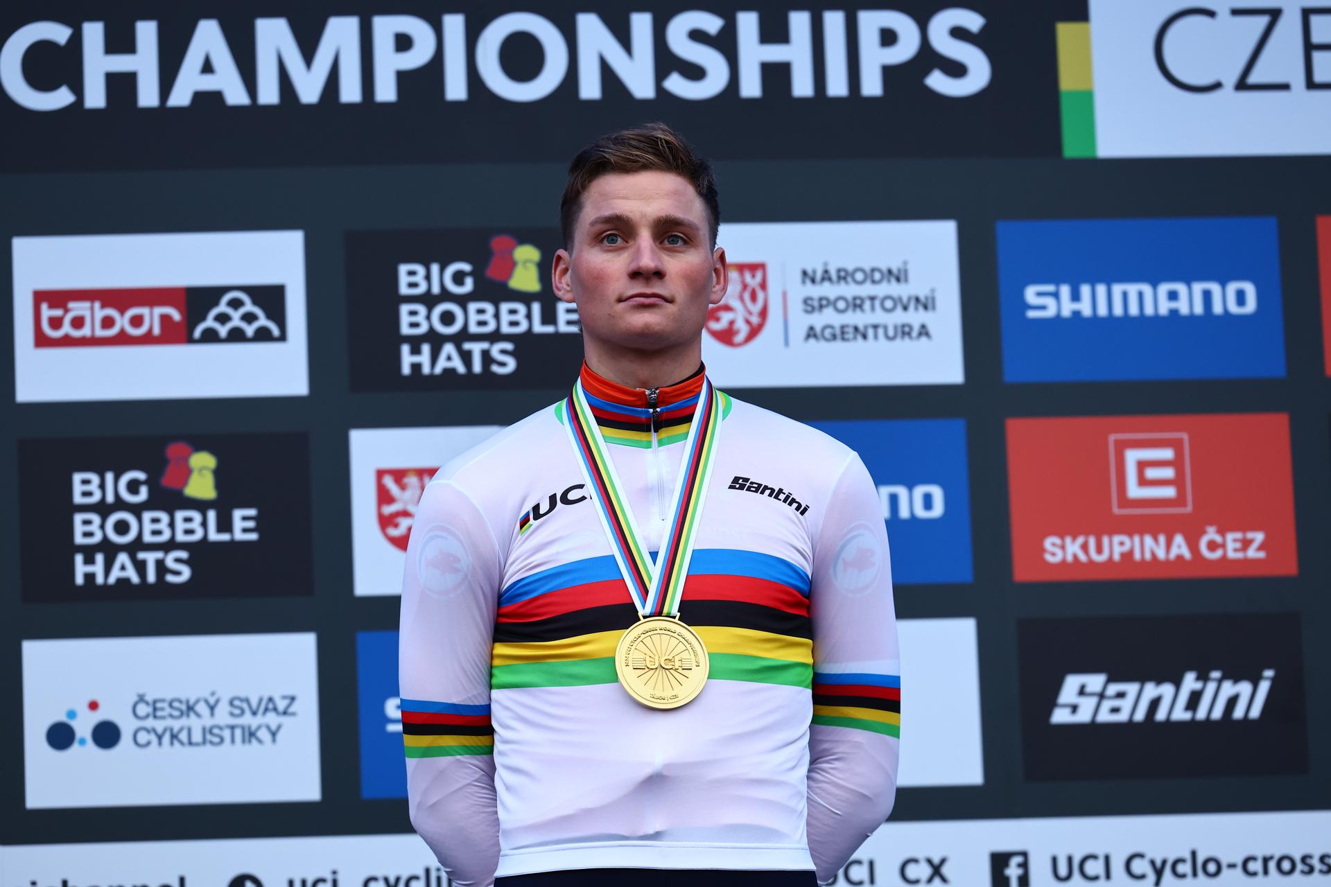 Dutch Mathieu Van Der Poel celebrates on the podium with his gold medal after the Elite men's race at the Cyclocross World Championships event on Sunday 04 February 2024 in Tabor, Czech Republic. BELGA PHOTO DAVID PINTENS