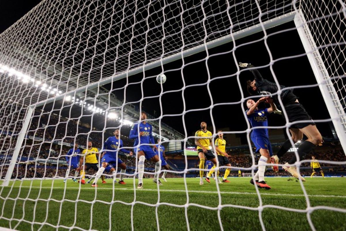 Chelsea's Belgian goalkeeper #39 Mike Penders concedes the teams first goal during the English League Cup third round football match between Chelsea and Leeds United at Stamford Bridge, in London on September 9, 2026. Adrian DENNIS / AFP